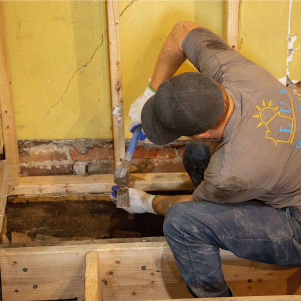 LUX Foundation Solutions team performing expert sistering floor joists installation in Ocala, FL, ensuring long-term floor stability.