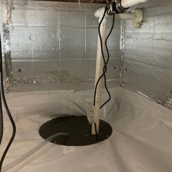 Installed crawl space sump pump system in St. Augustine, FL, designed to prevent flooding and water damage in the crawl space.