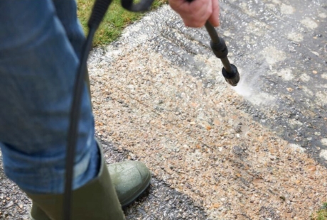 A professional applying protective concrete sealing in Florida to block moisture, enhance durability, and extend surface life.