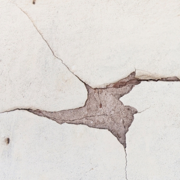 Interior drywall cracking above the window, needing drywall crack repair in Northern Florida.