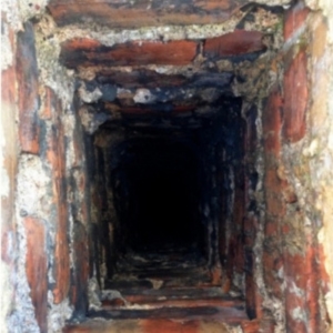 Water damage on chimney bricks due to frequent rain and humidity causes of cracked chimney bricks in Middleburg, FL.