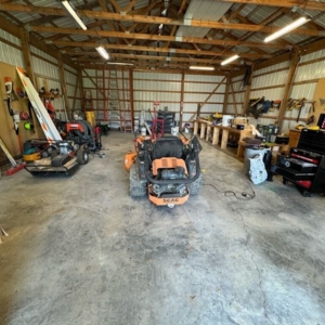 Garages with parked heavy vehicles create concrete load stress, causing a cracked garage floor in Palatka, FL.
