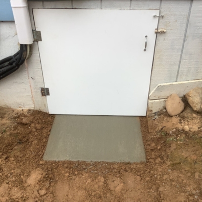 Newly sealed crawl space door blocking rodent entry and moisture, a crawl space pest solution in Orange Park, FL.