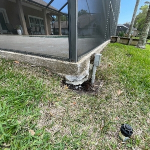Eroded sandy soil under a pool deck causes of cracks in pool decks in Palm Coast, FL.