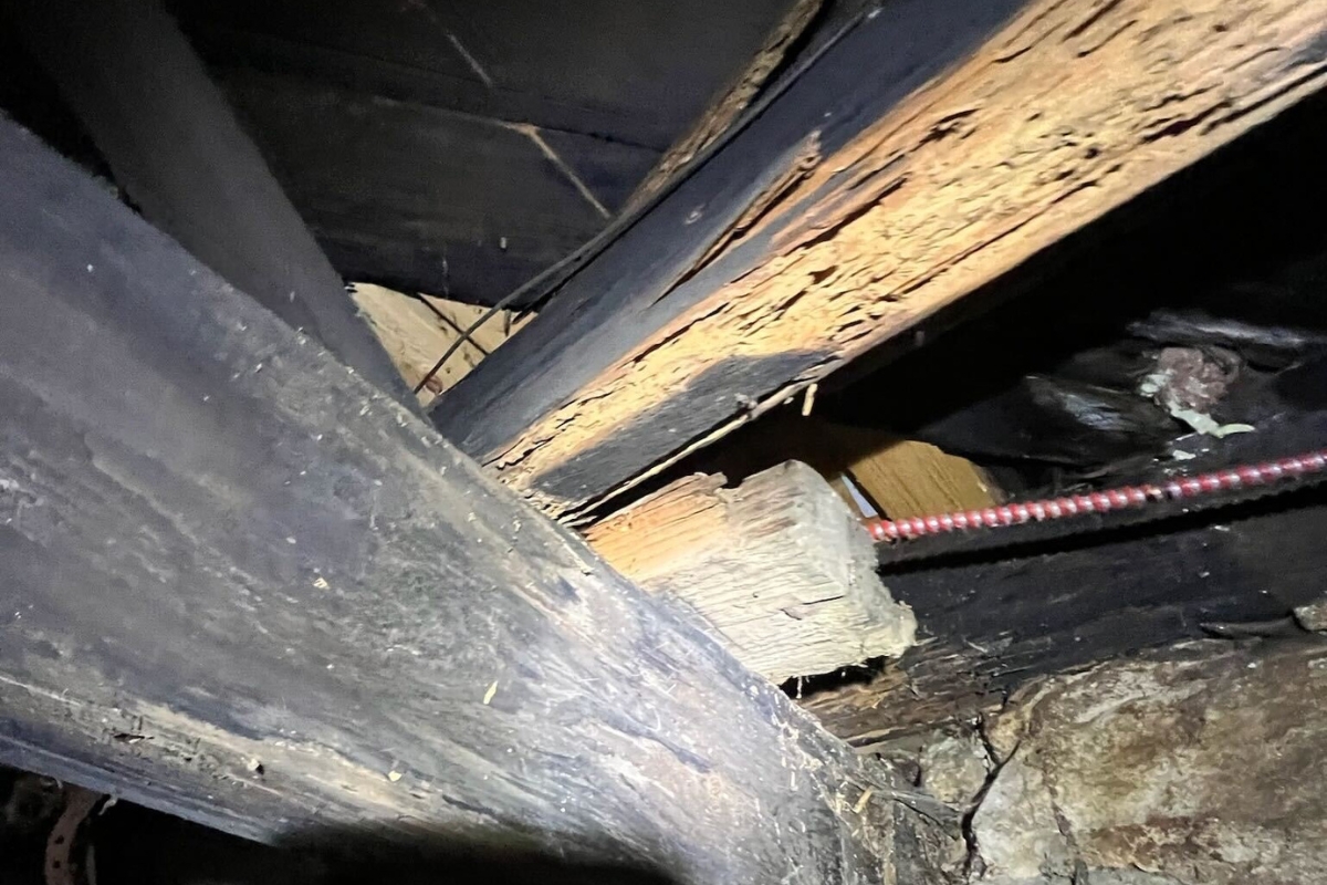 Deteriorated crawl space joists weakened by age and decay, showing how aging wood leads to floor joist damage in Fort Lauderdale, FL.