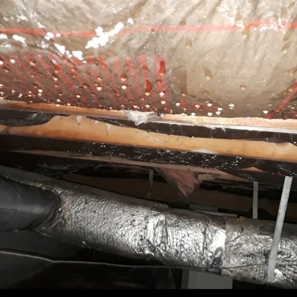 Crawl space condensation on ductwork, showing moisture buildup that needs a crawl space moisture solution in Jacksonville, FL.
