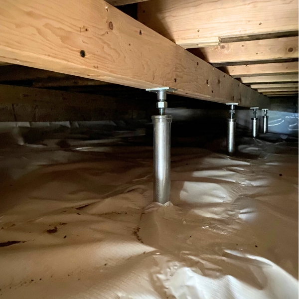 Installed adjustable steel support posts to lift and stabilize sagging floors, a crawlspace solution in Middleburg, FL.