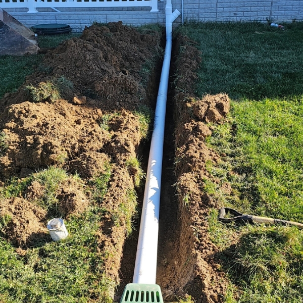 Downspout extension added to divert rainwater away from a home, a rainwater waterproofing solution in Palatka, FL.