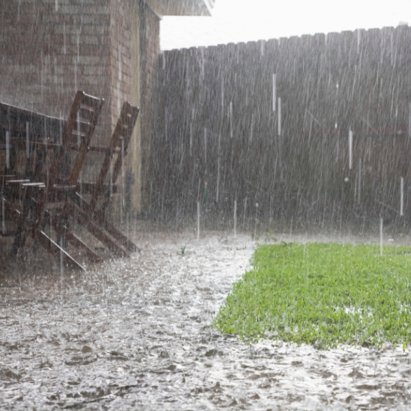 Rainwater pooling in the front yard due to excessive rainfall; needs a waterproofing solution in Jacksonville, FL.