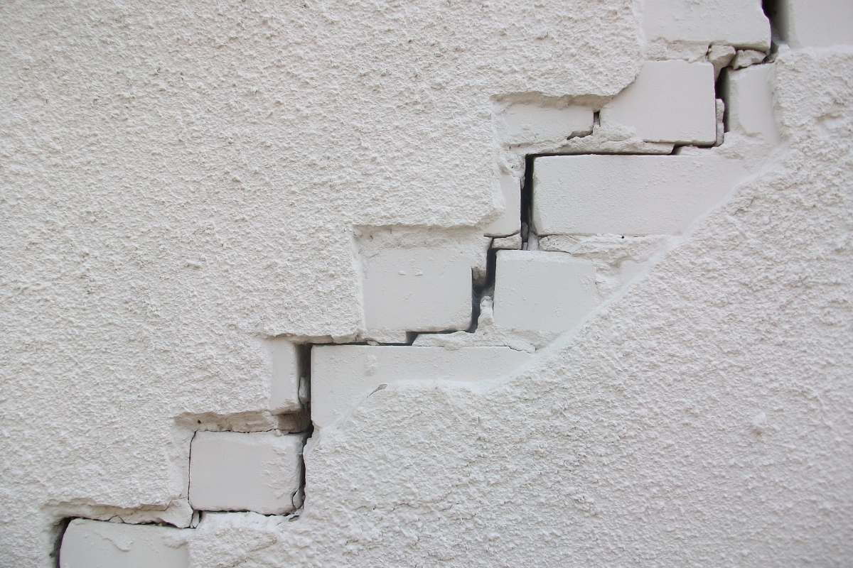 New cracks forming on a home's concrete wall, a sign of excessive rainfall damage in St Johns, FL.