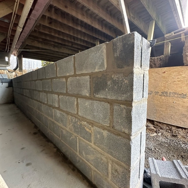 An ongoing rebuild of a damaged foundation wall with reinforced concrete—a foundation repair solution in Middleburg, FL.