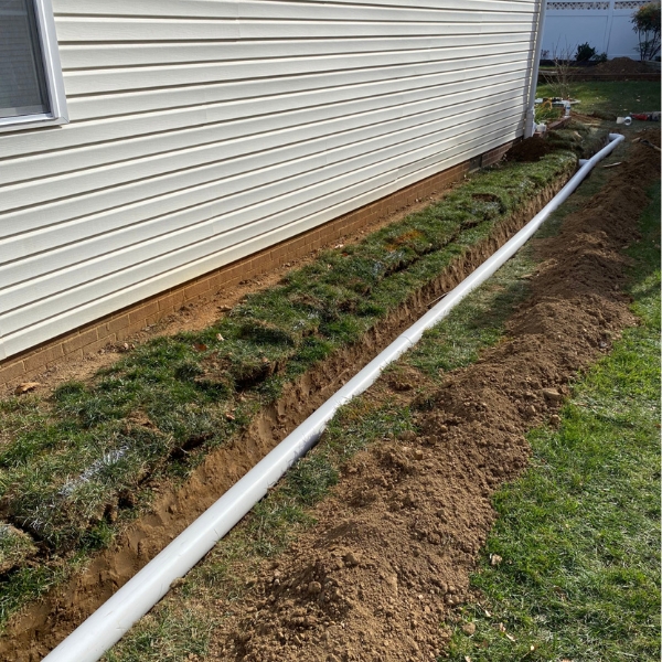 French drain installed to redirect groundwater away from a home, a foundation drainage solution in Fernandina Beach, FL
