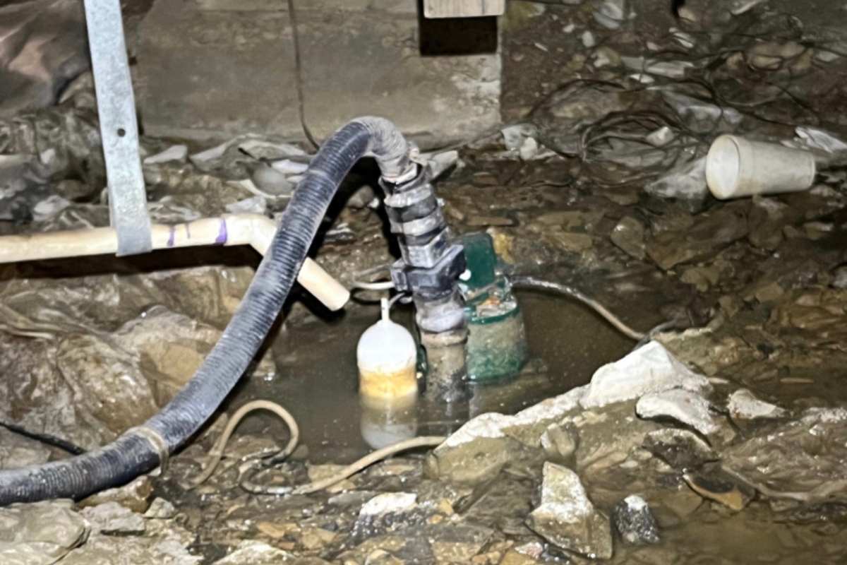 Faulty sump pump discharge and loose plumbing connections, causing plumbing leaks in Palm Coast, FL.