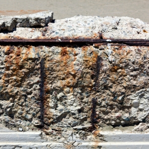 Corroded metal tiebacks and cracked seawall surface from saltwater damage cause seawall erosion damage in Ocala, FL.