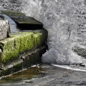 Saltwater splashing on the seawall causes steel oxidation inside and seawall rust in Palm Coast, FL.