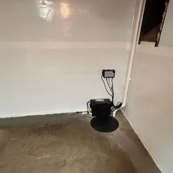 Sump pump installed to remove groundwater before it floods the basement, a groundwater flow damage solution in Crescent City, FL.