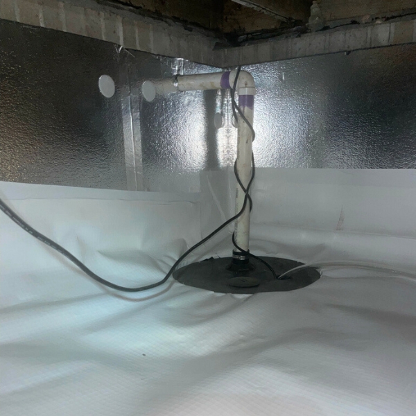 Sump pump installed to remove stormwater, a rainwater waterproofing solution in Fort Lauderdale, FL.