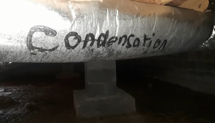 Condensation forming on crawl space pipes due to humidity and poor airflow, a sign of a crawl space problem, Palm Coast, FL.