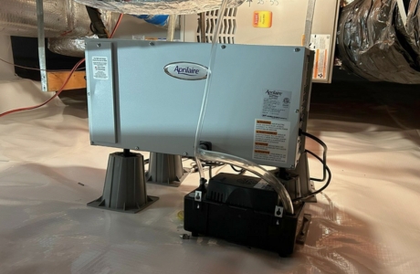 Crawl space dehumidifier installed to regulate humidity levels beneath home, a crawl space repair solution in Jacksonville, FL.