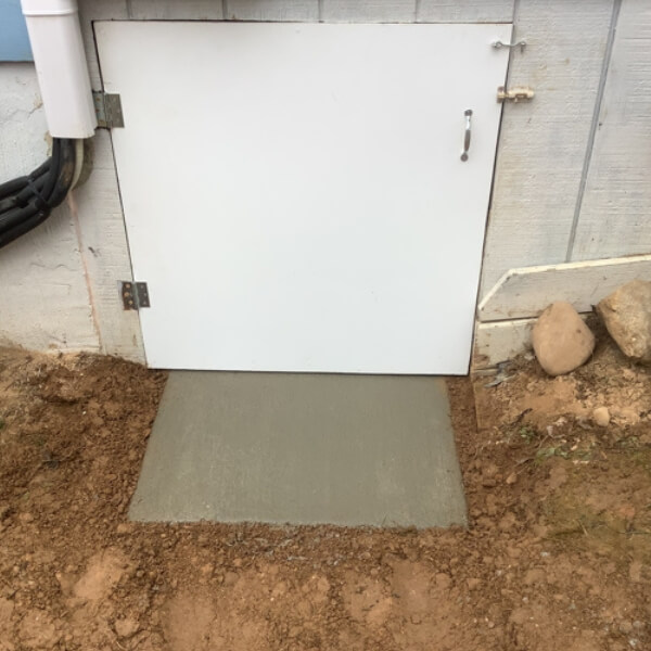 Sealed crawl-space access door preventing moisture and pests; insulation-damaged solution in Crescent City, FL.