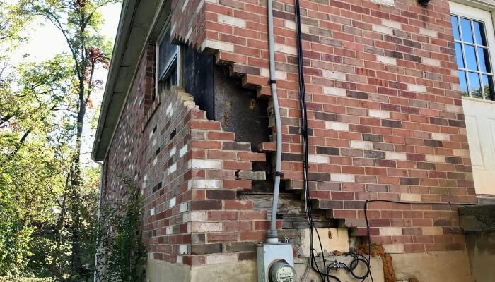 Foundation settlement visible near a Palm Coast home, showing uneven structural support caused by soil movement.
