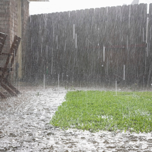 Flooded yard that can seep into the crawl space due to heavy rainfall, needing a crawl space moisture solution in Jacksonville, FL.