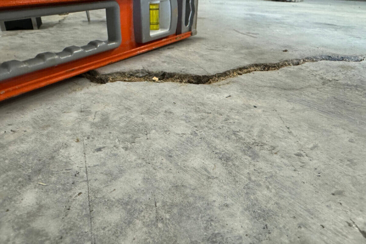 Concrete slab cracks and unevenness, causes of concrete heavy load damage in Ocala, FL.
