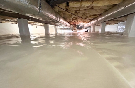 Encapsulated crawl space in Lake City, FL, creating a sealed environment to manage moisture and air movement.