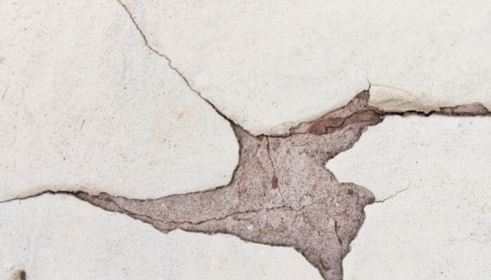 Interior drywall cracks in a Lake City, FL home, appearing near door frames, a common sign of underlying foundation damage.