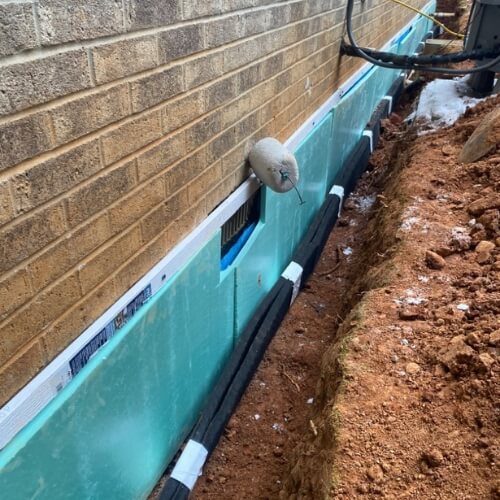 Exterior foundation waterproofing panel and drainage installed for waterproofing in Gainesville, Florida, to stop water intrusion.