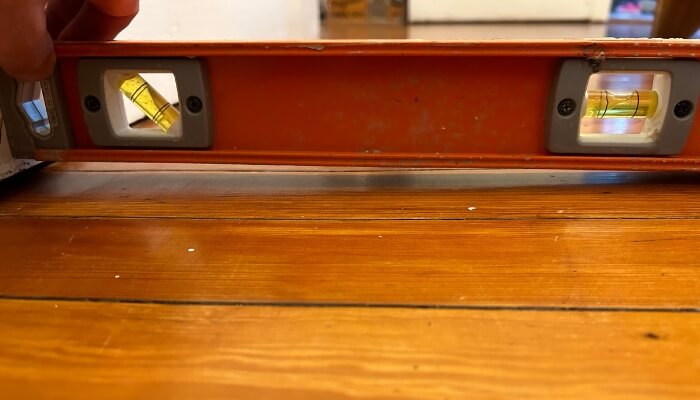 Interior floor showing unlevel areas in Ocala, FL, due to crawl space support movement, a sign of a crawl space problem.