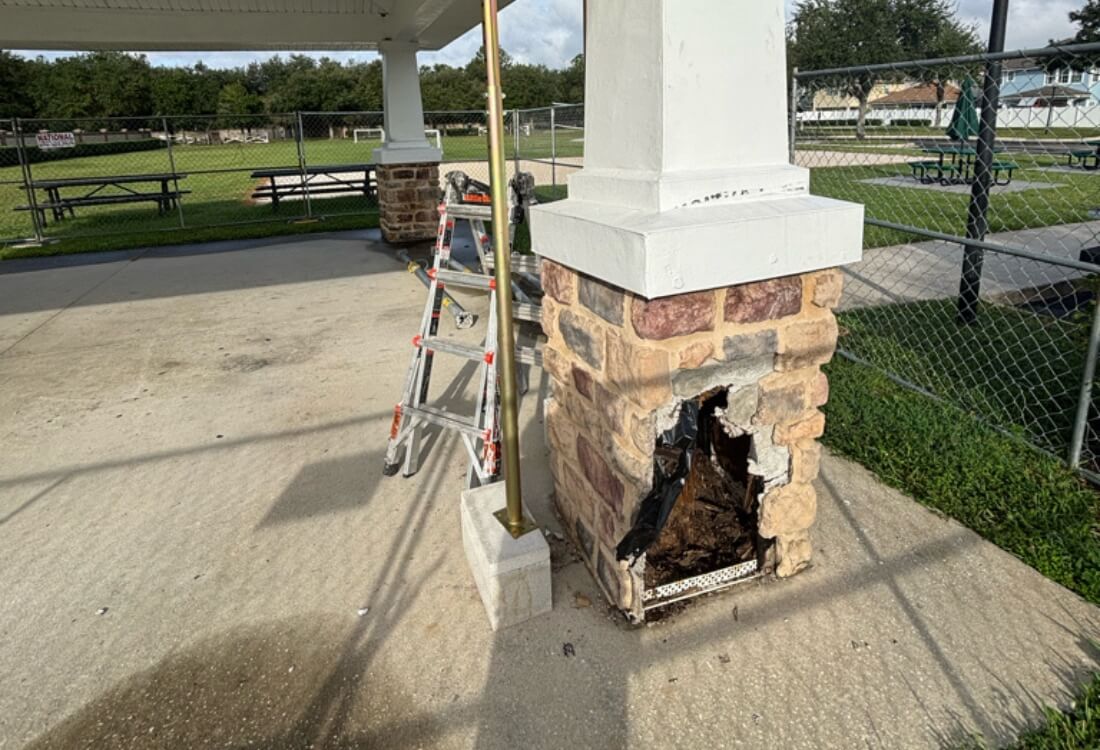 Severely rotted gazebo post base before structural repair in Jacksonville, FL, showing moisture-damaged wood.