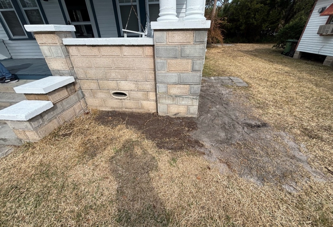 Stabilized front porch with leveled columns and restored masonry after concrete front porch repair in St. Augustine, FL.