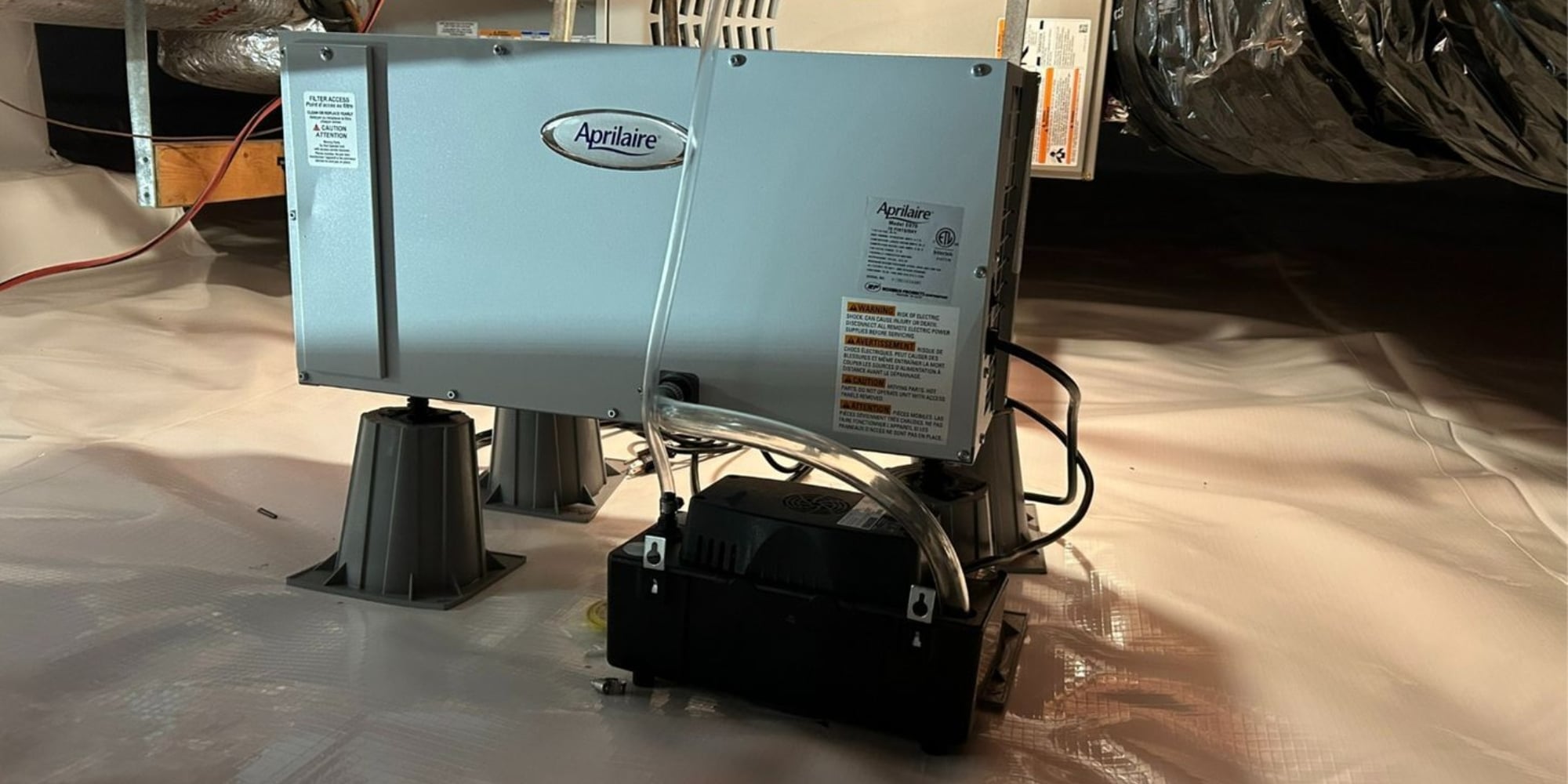 Installed crawl space dehumidifier providing moisture control, a benefit of a dehumidifier in crawl space in Northern, FL.
