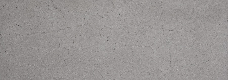 Network of shrinkage cracks across new concrete foundation surface as it cures and dries, type of foundation cracks in Middleburg, FL.