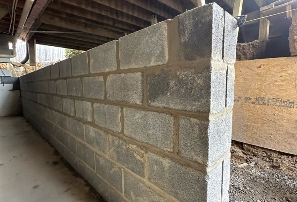 Replaced foundation wall on a home to restore structural integrity, a bowed foundation wall repair method in Middleburg, FL.