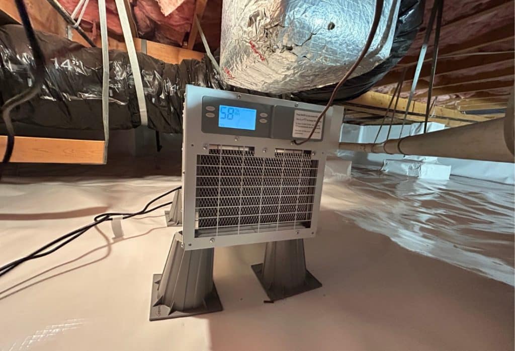 Crawl space dehumidifier installed and running inside controlling humidity to get rid of musty smell in crawl space in Ocala, FL.