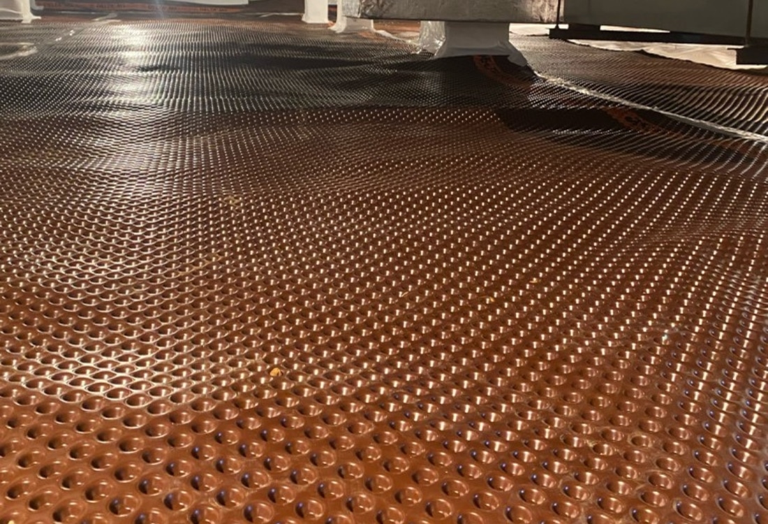 Installed drainage mat in crawl space to channel water into the drainage system, a foundation waterproofing method in Gainesville, FL.