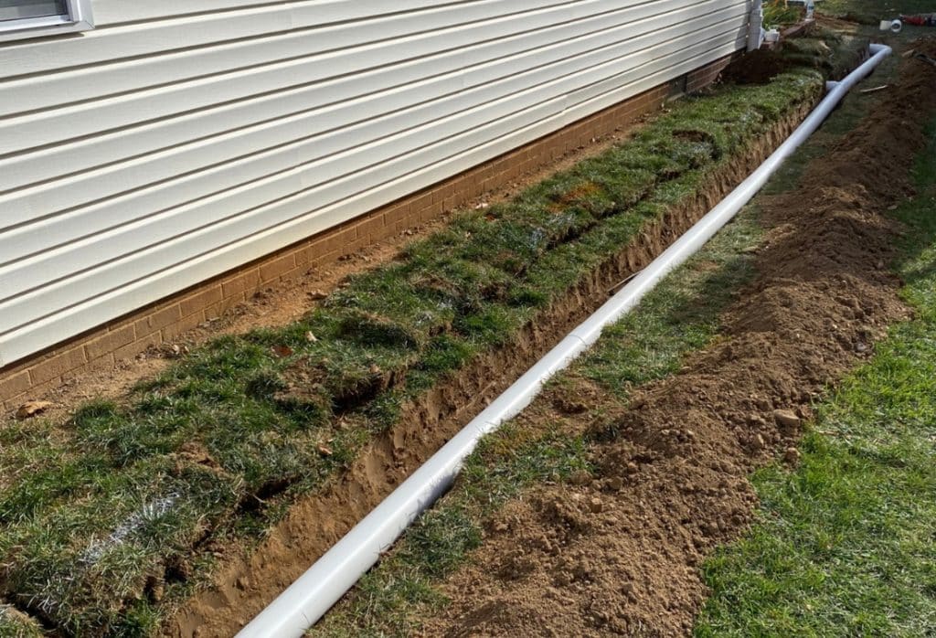 Installed French drain around home perimeter to stop water pooling around foundation in Palm Coast, FL.